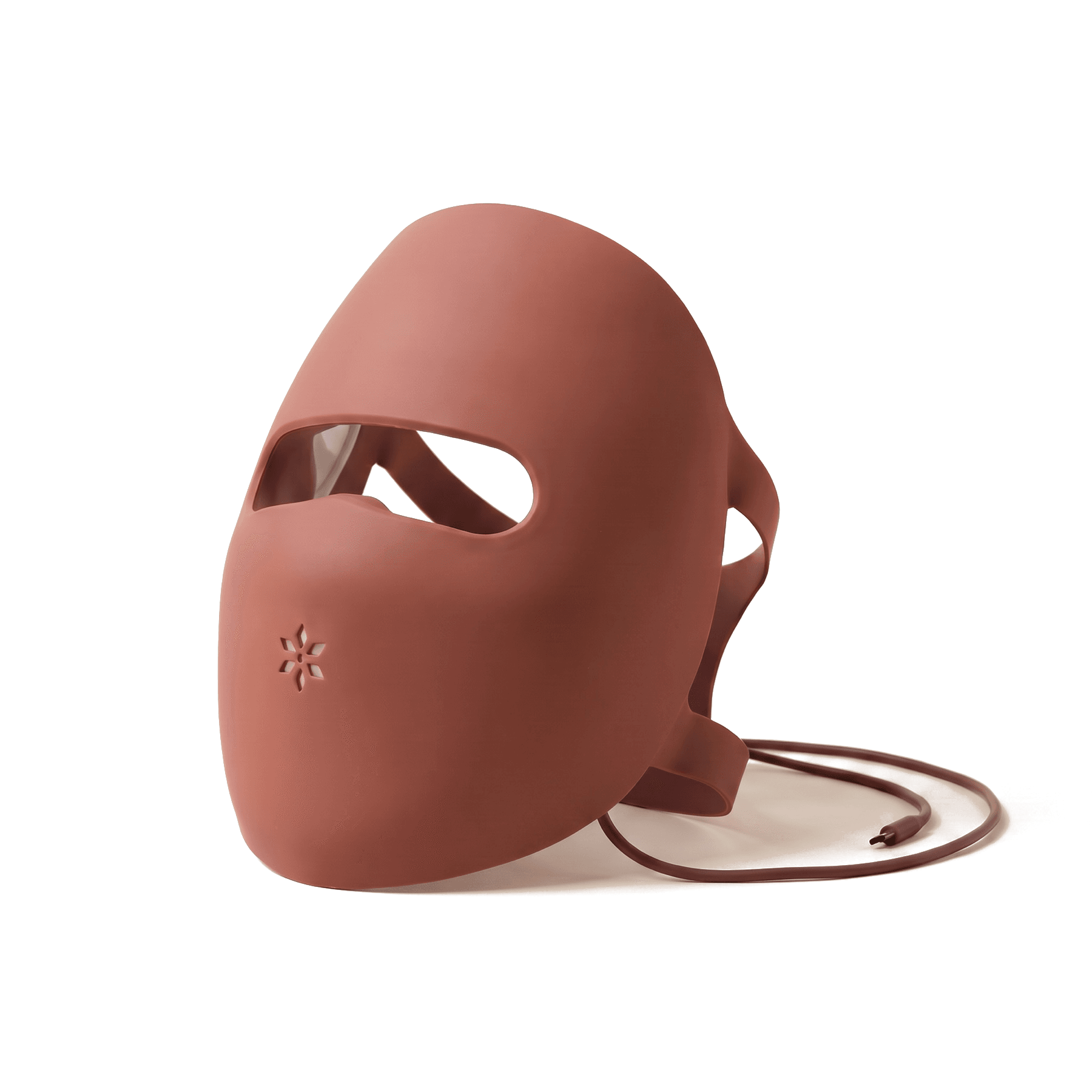 The Albelys mask with its cord and strap, photographed against a plain studio backdrop